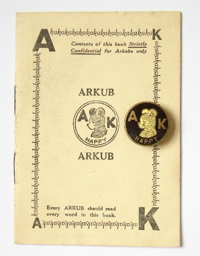 Arkubs Happy Bear badge and secret book of rules