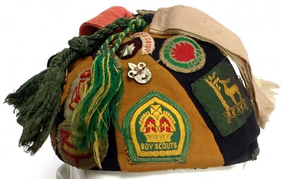 Kings Scouts collection of cloth badges sewn to c1940s cap