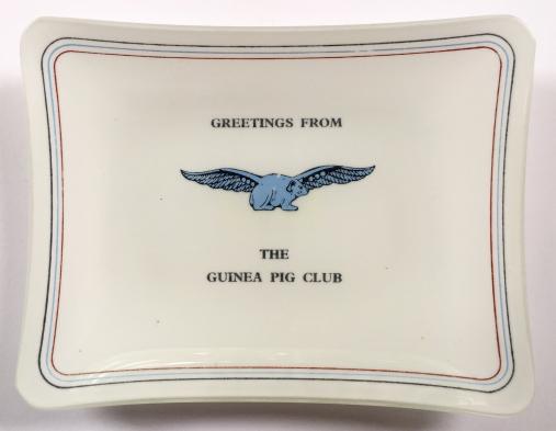 Greetings Fom The Guinea Pig Club opaque glass souvenir dish