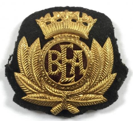 BEA Airline gilt metal and felt cloth hat badge