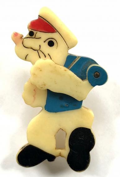 Popeye the Sailor cartoon character badge with articulating arm