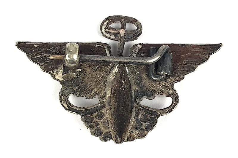Austin Motor Company winged steering wheel advertising pin badge